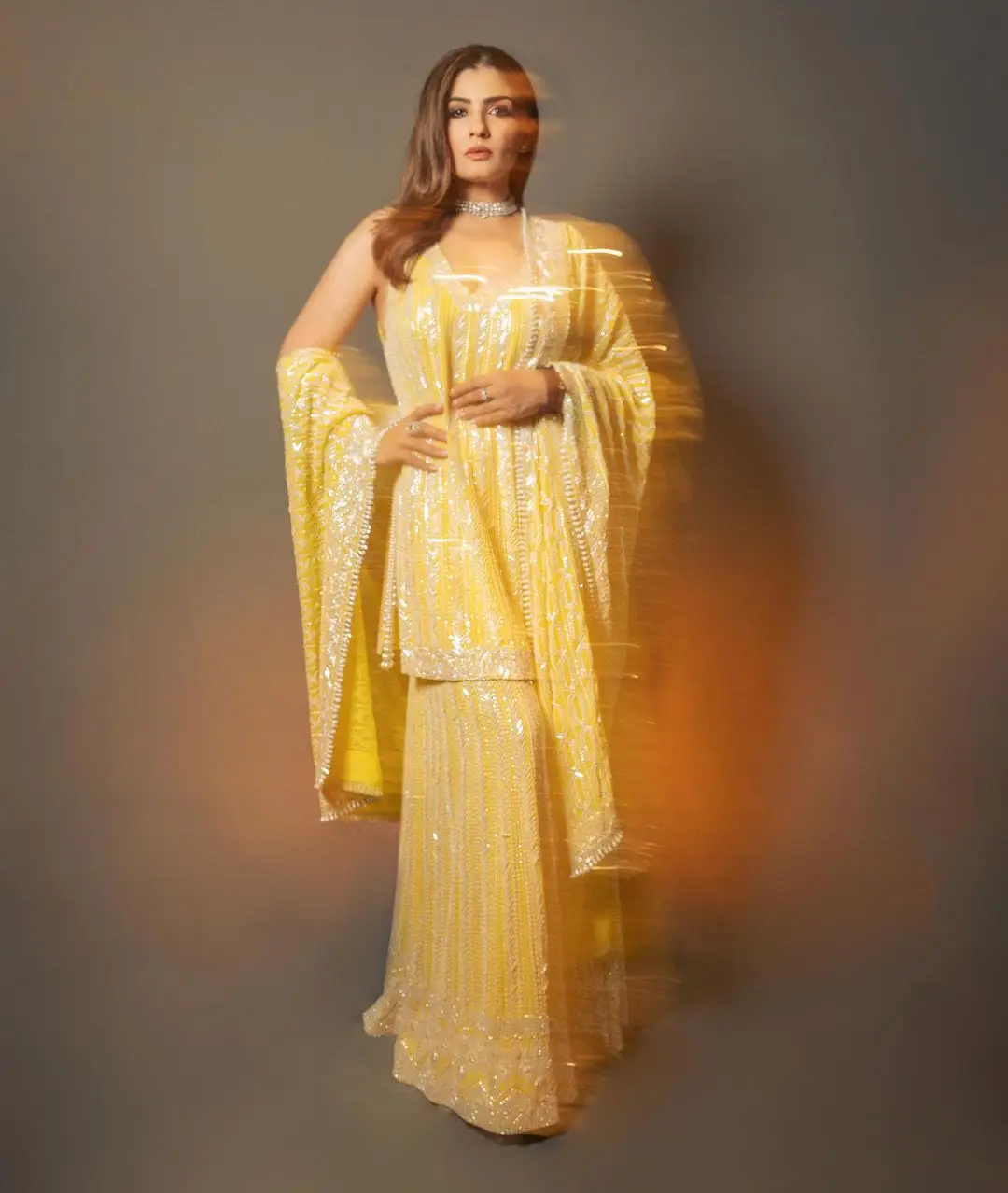 Raveena Tandon Wearing Beautiful Earring Yellow Gown